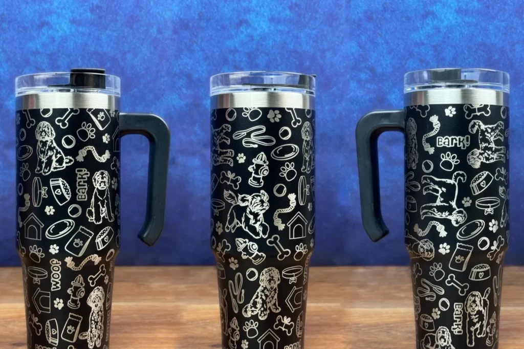 Three stainless steel cups with a black background