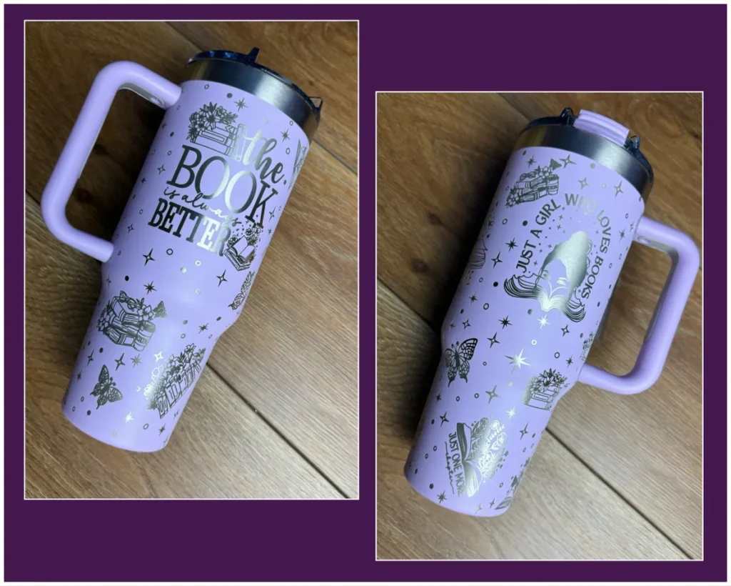 A purple cup with a handle on top of the ground.