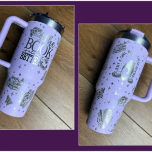 A purple cup with a handle on top of the ground.