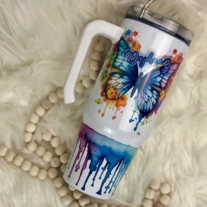 A white cup with a butterfly design on it