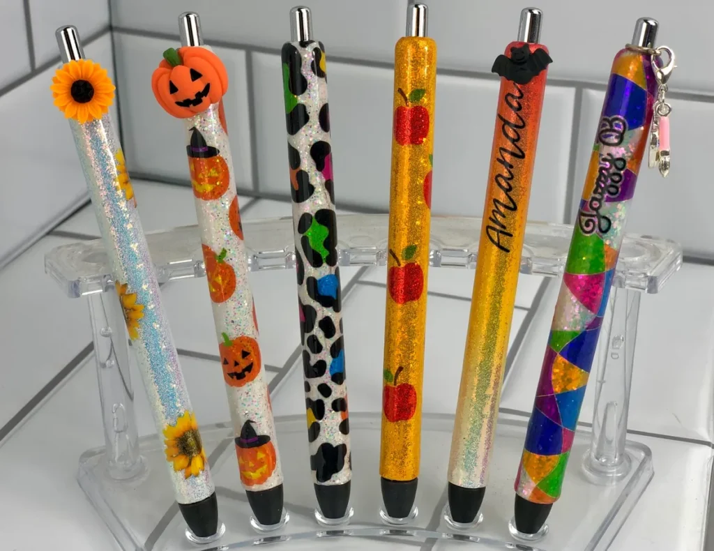 A group of pens with different designs on them.