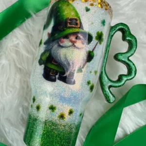 A green and white candle with a picture of a gnome.