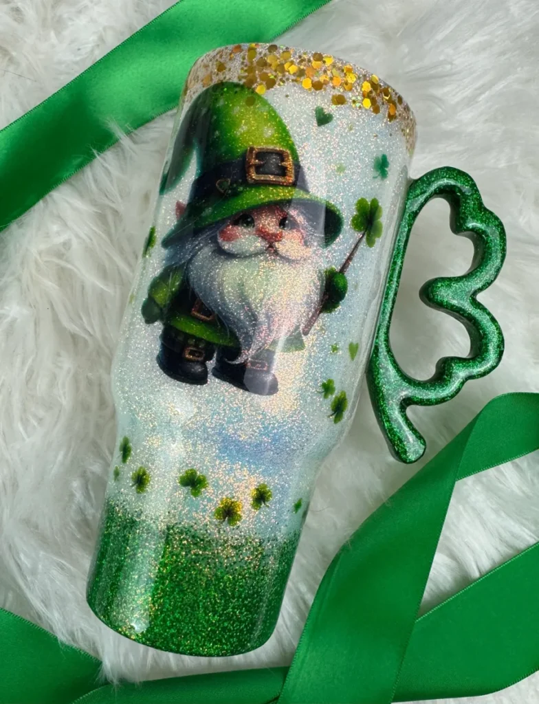 A green and white candle with a picture of a gnome.
