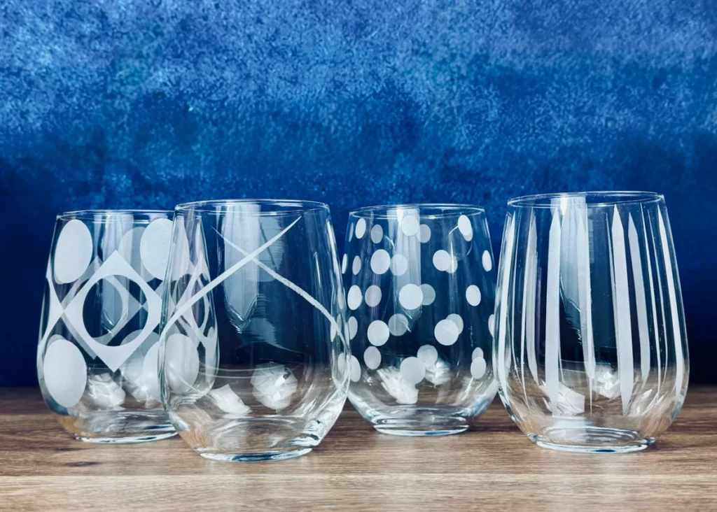 Patterned glassware against a blue background.