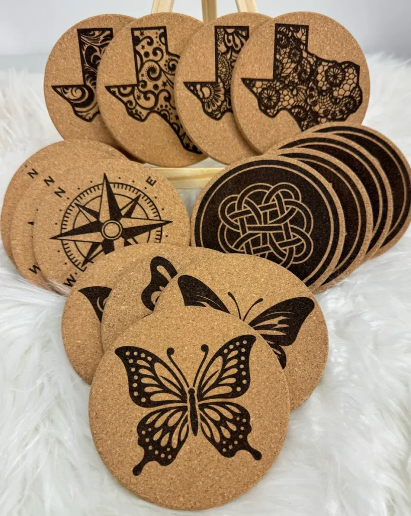 Round cork coasters featuring butterfly and Texas designs