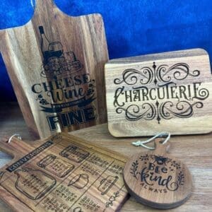 Decorative wooden kitchen boards with designs.