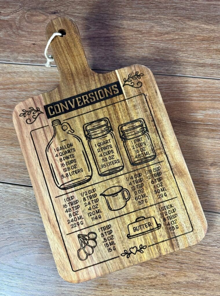 Wooden cutting board with conversion measurements.