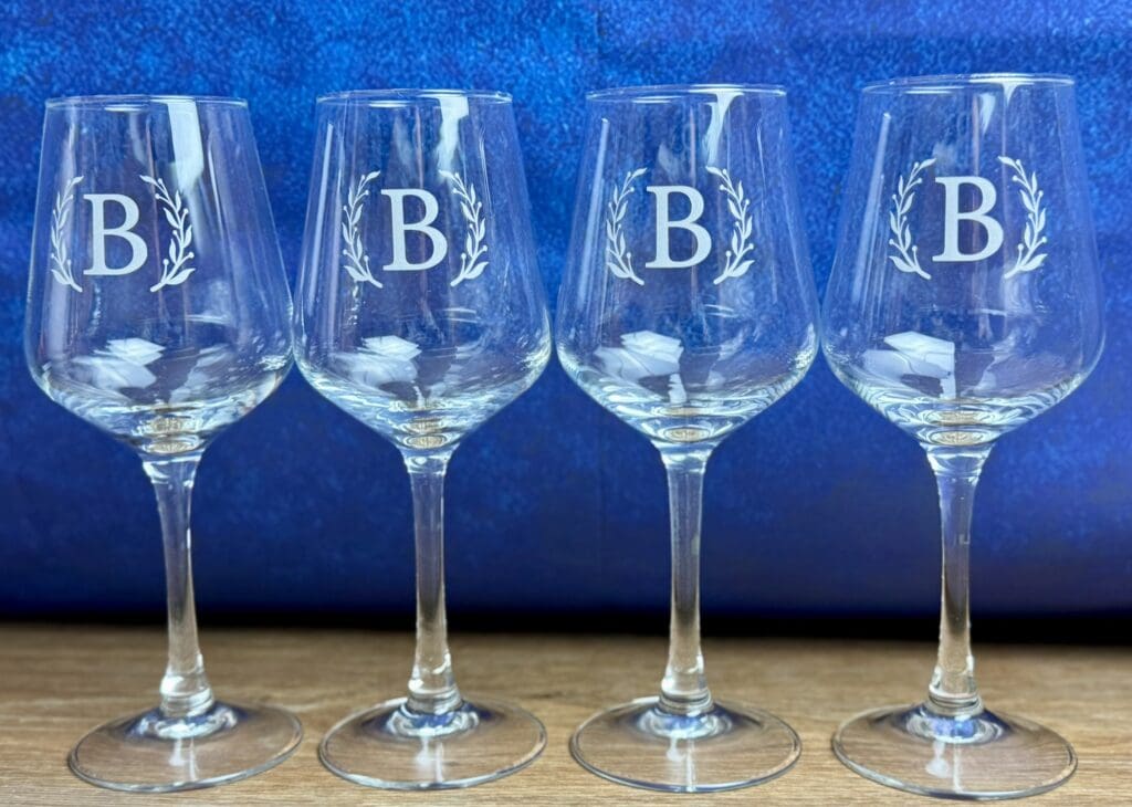 four glass with letter B printed on them