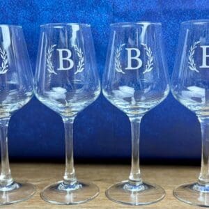 four glass with letter B printed on them