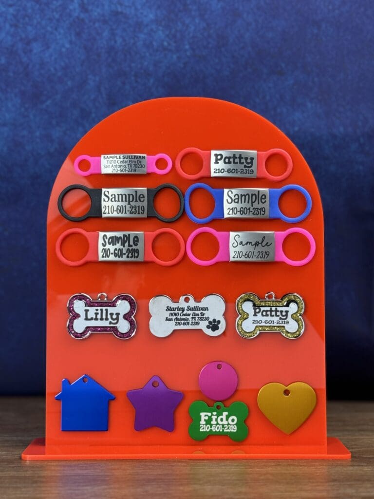 Aluminum Pet ID Tags on a red surface