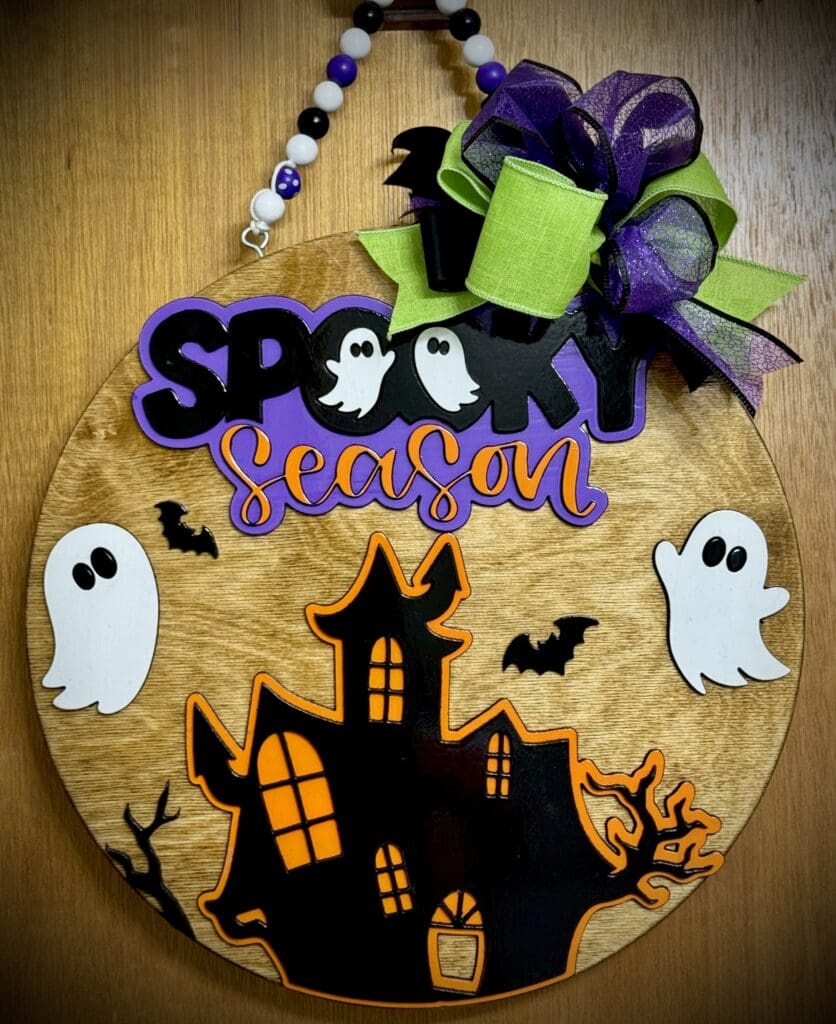 Halloween decoration with ghosts and haunted house.