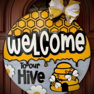 Round welcome sign with bees and hive