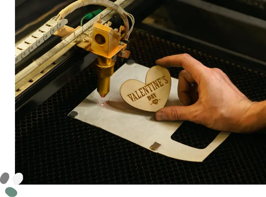 Laser cutting a Valentine's Day heart.