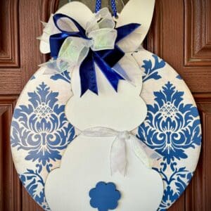 Bunny-shaped door decoration with blue patterns.