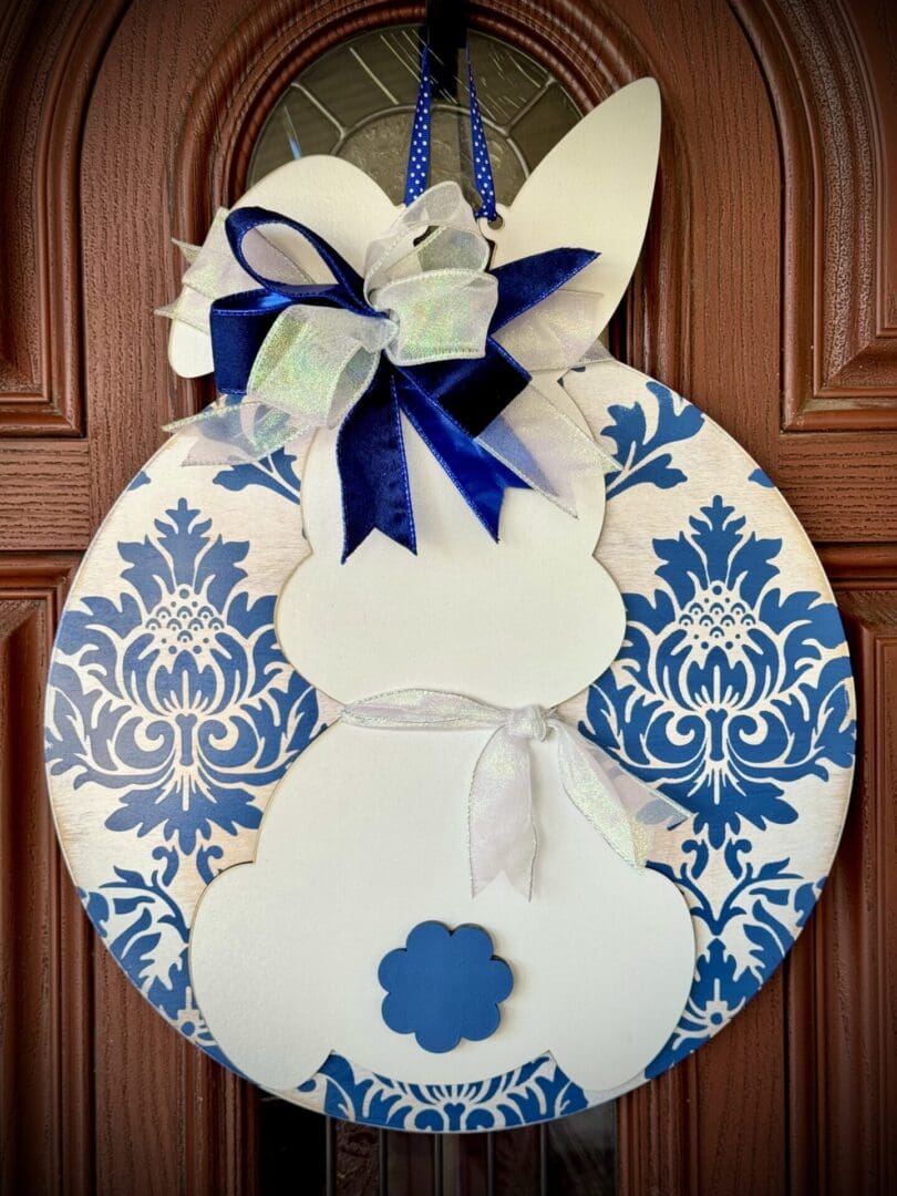 Bunny-shaped door decoration with blue patterns.