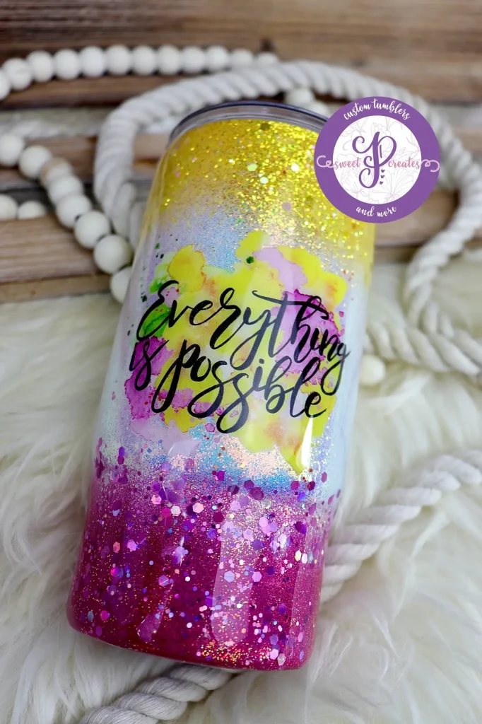 Colorful tumbler with "Everything is Possible" design.