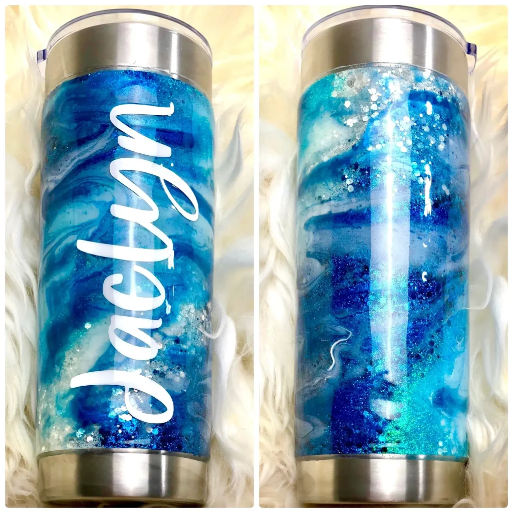 Blue marbled tumbler with personalized name.