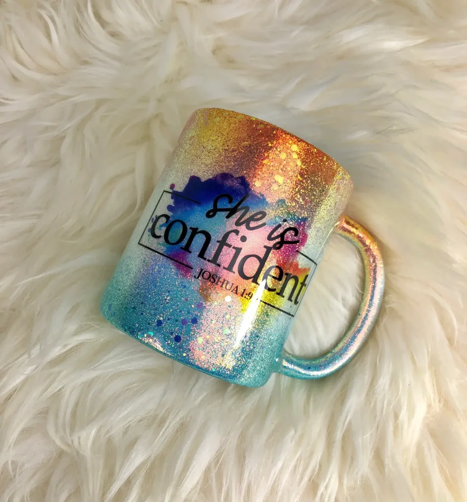 Colorful mug with "She is confident" design.