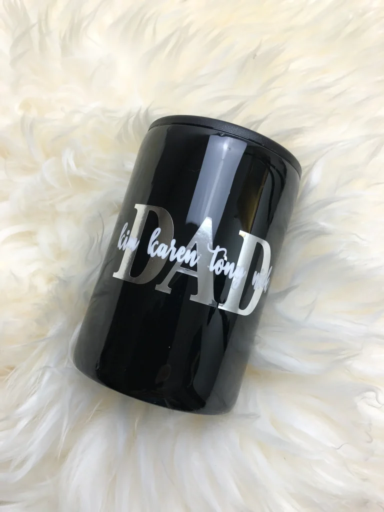 Black cup with "DAD" text design.