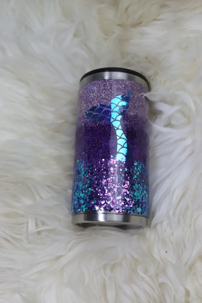 Glittery purple tumbler with a mermaid tail.