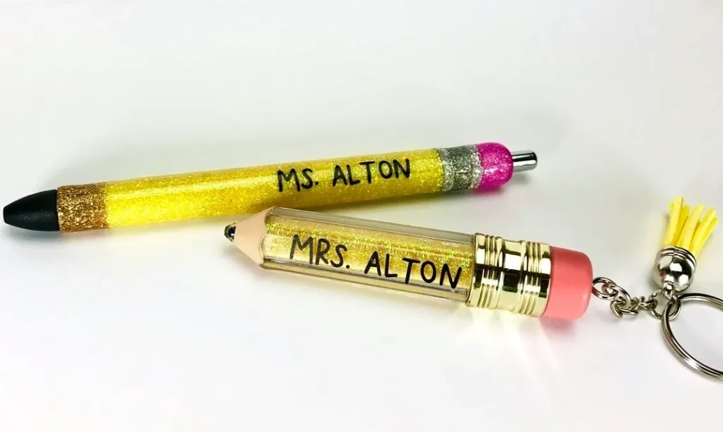 Two personalized glitter pens and keychain.