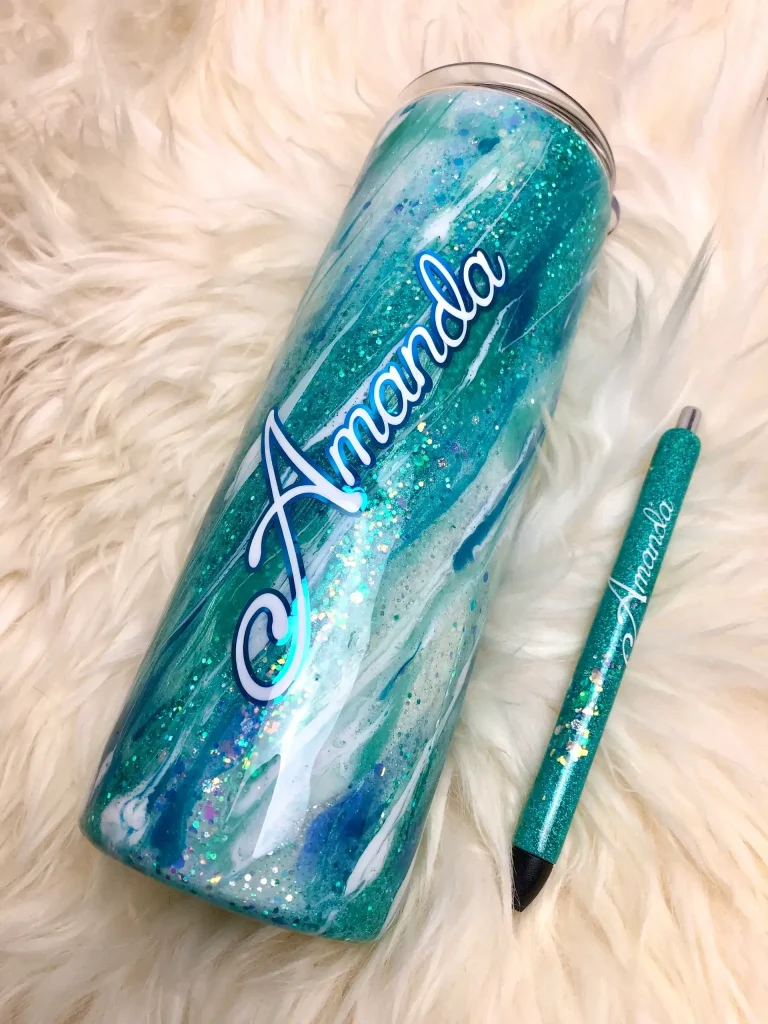 Personalized teal tumbler and matching pen.