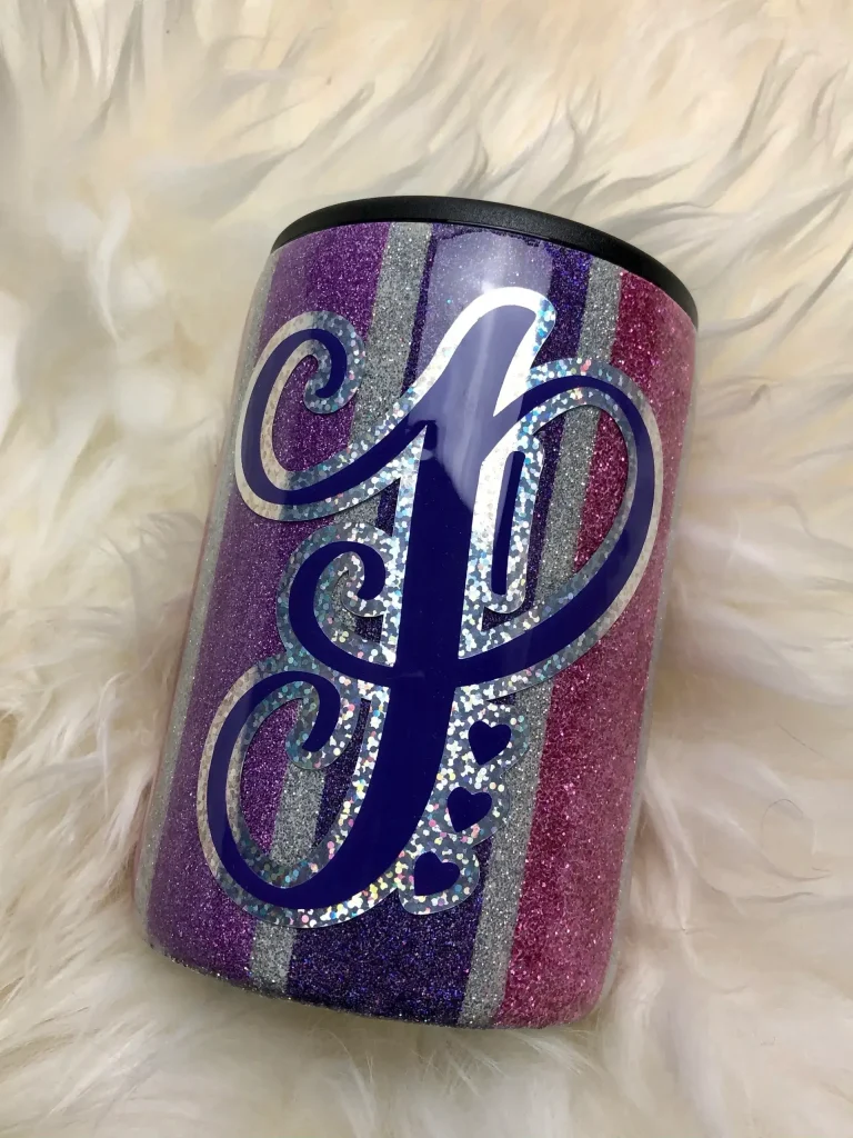 Glittery cup with purple and silver design.