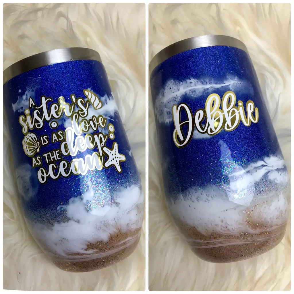 Glittery blue tumbler with personalized text.