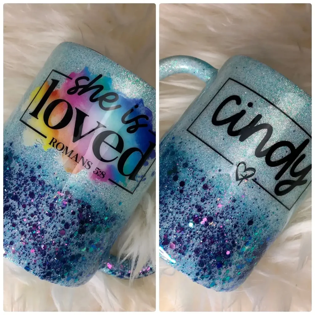 Aqua glitter mug reading 'she is loved'